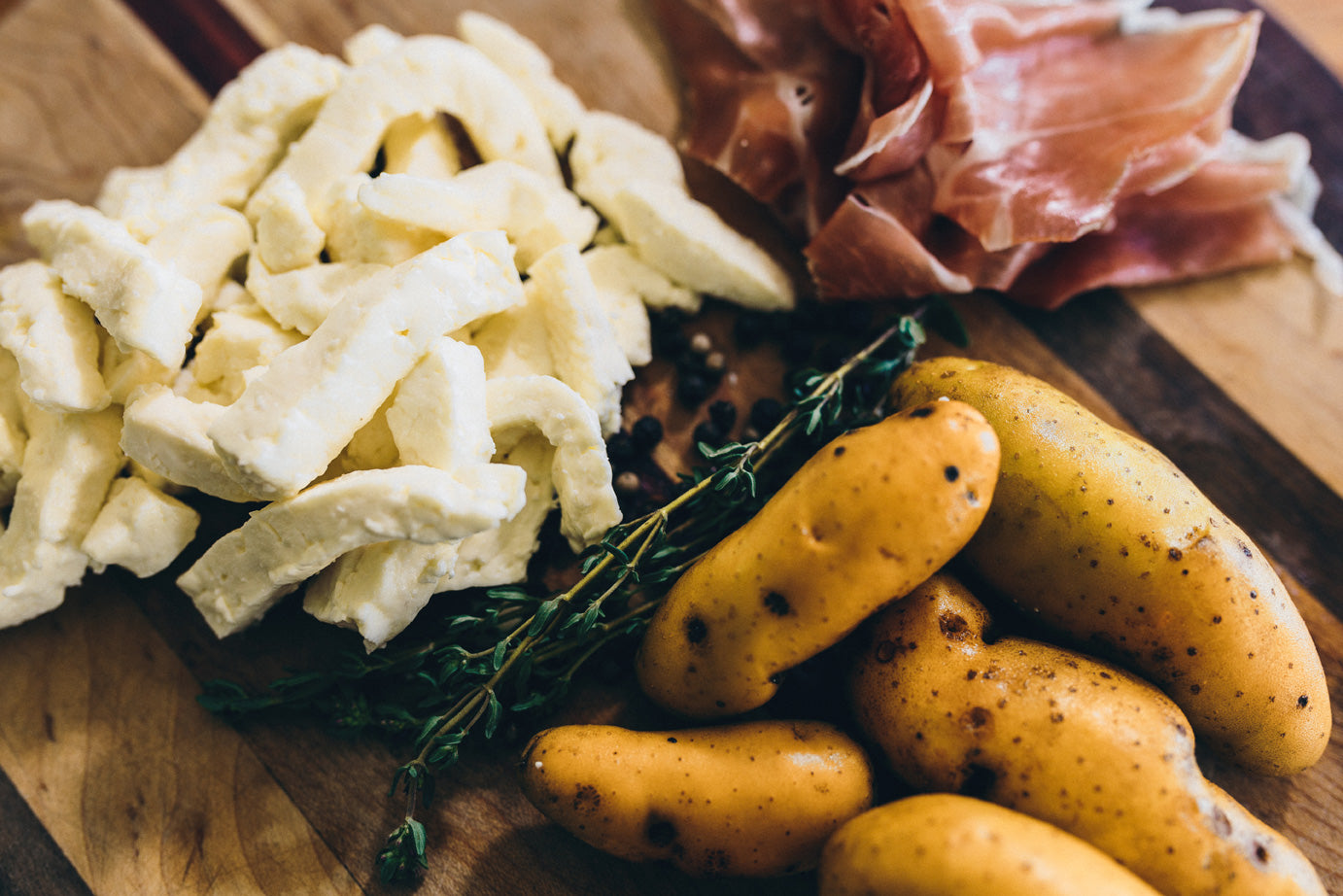 Fresh curd is displayed alongside French fingerling potatoes; a nod to the classic poutine.