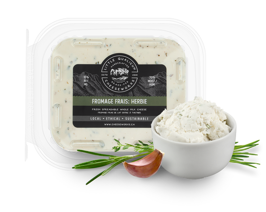 Fromage frais herbie with bowl of cheese and garlic and fresh herbs