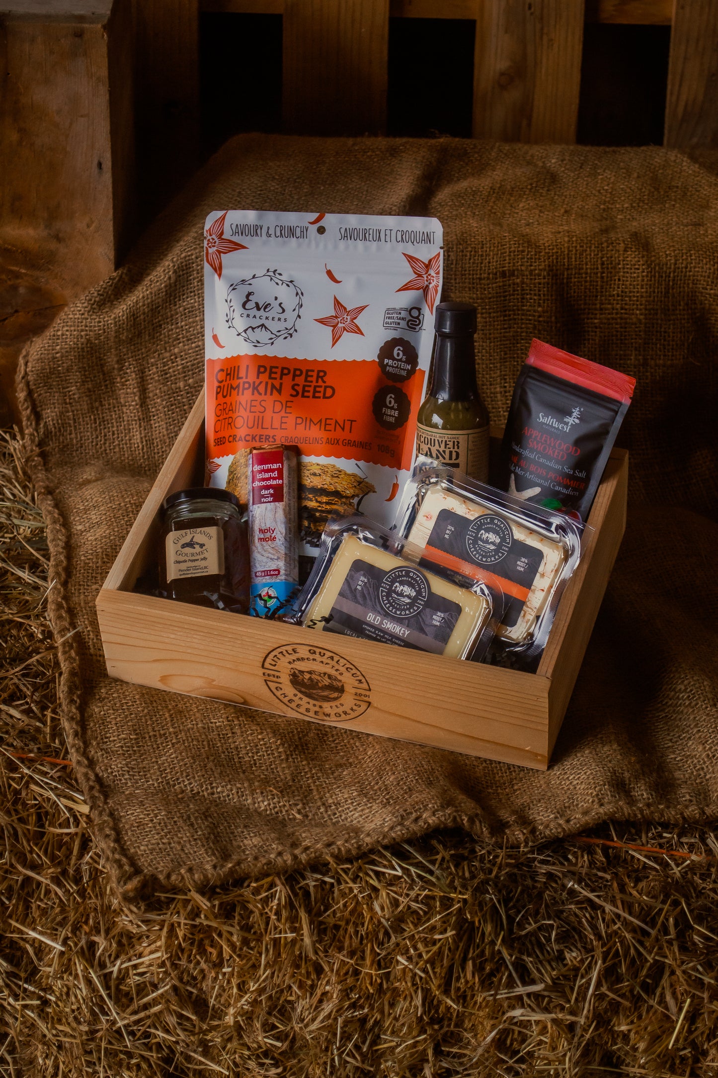 A smokey-spicy themed gift basket with various local BC items, including Hot Jill and Old Smokey cheese, crackers, sea salt, chocolate, and preserves.