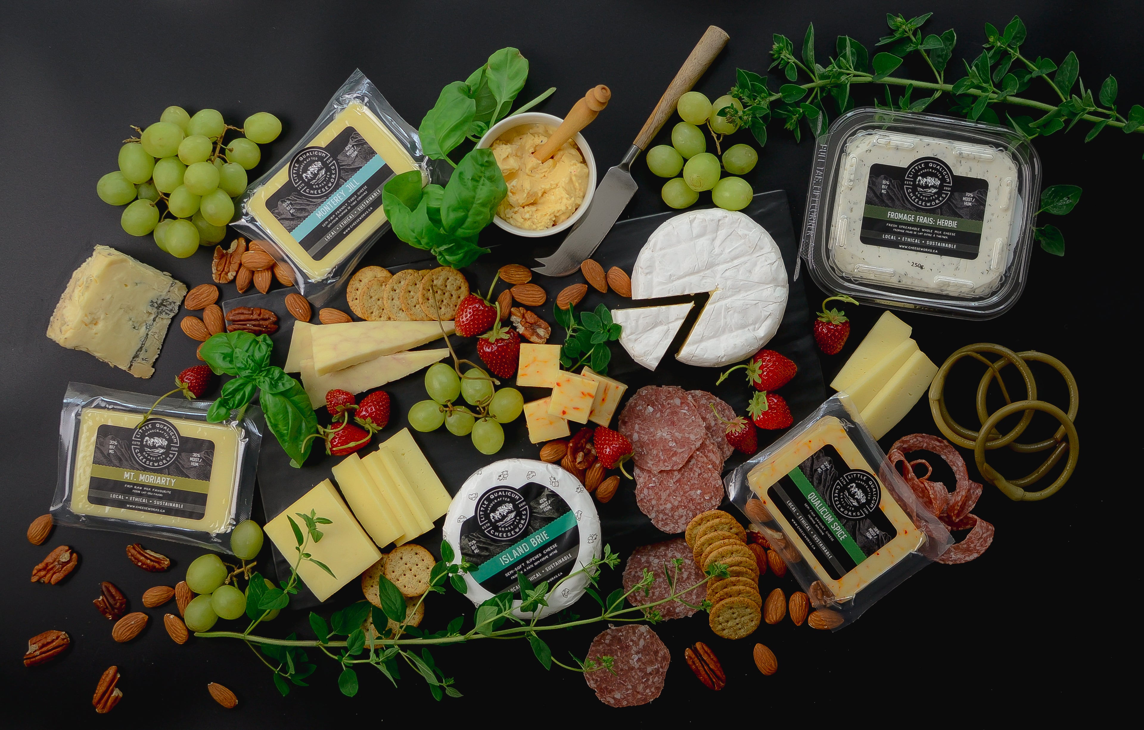 An charcuterie arrangement showcases Little Qualicum Cheeseworks cheeses