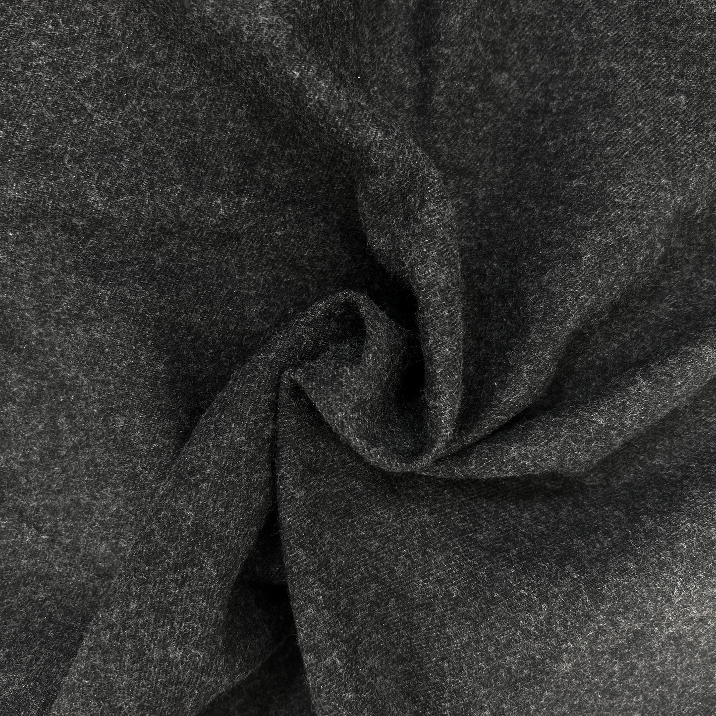 Close-up of dark gray flannel shirt with a textured surface