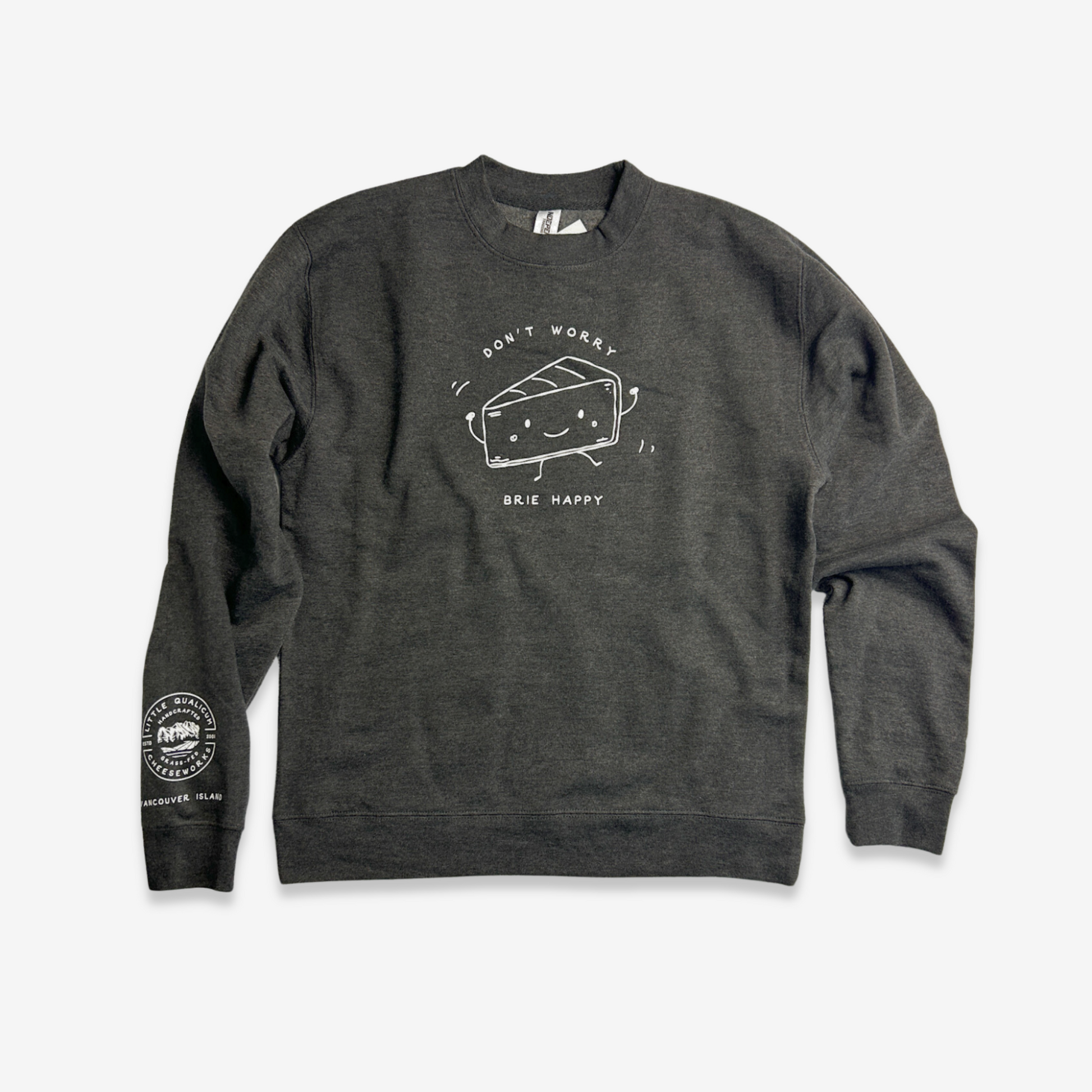 The artwork on the charcoal heather sweatshirt is printed in a contrasting white. The sweatshirt has long sleeves. At the lower end of the left sleeve near the cuff, the LQC logo is printed with "Vancouver Island" written below. On the front of the sweatshirt is an 8" line drawing of a personified wedge of Brie. The Brie dances with little arms in the air and smiles. The text  "Don't worry, Brie happy" is written around the illustration.