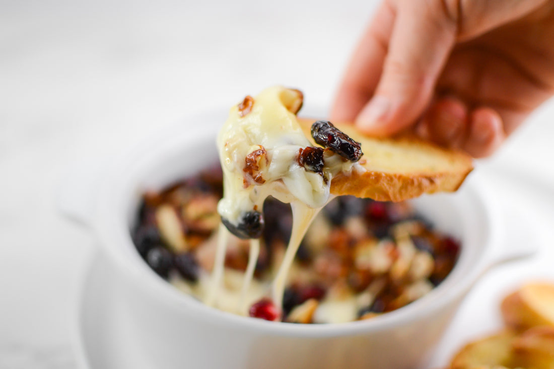 Warmed Brie with Cranberry Almond Honey Crunch Topping