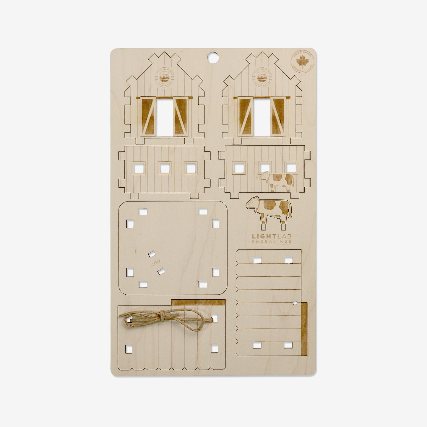 This wood ornament comes as a flat wood "card". Each piece is pre-cut and snaps out of the sheet for self-assembly. Included are four walls, a base, two roof pieces, and a cow to attach inside the barn. Each piece is tabbed so they click together.