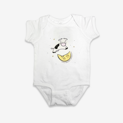 White baby onesie with a cute 6" illustration of a Holstein cow jumping over a moon made of cheese with stars in the background. Little Qualicum Cheeseworks is written around the edge of the moon.