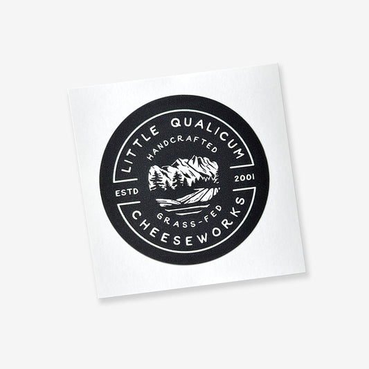 The round black sticker has the LQC logo in white. The sticker is on an easy-peel square back.