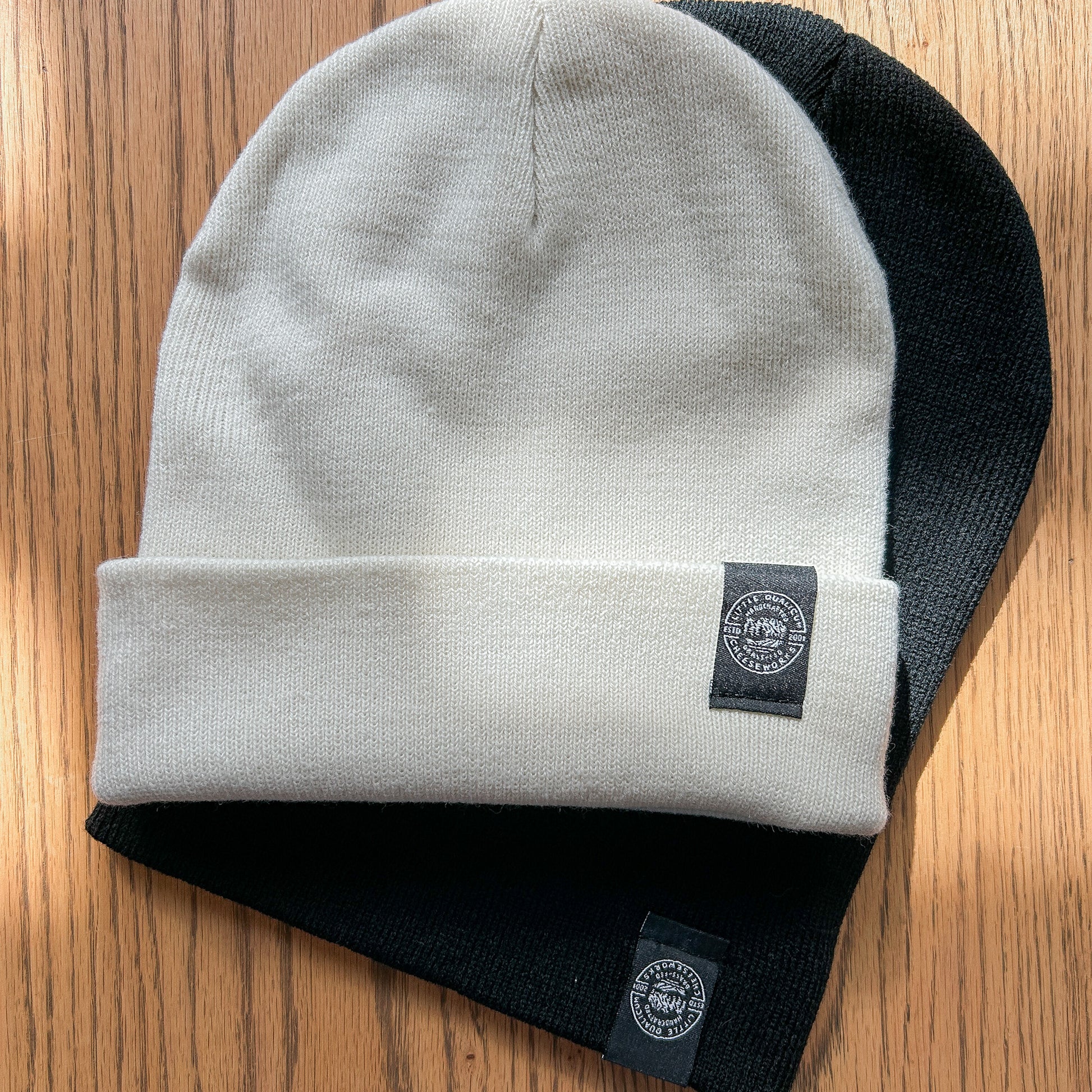 Toques with double-sided woven edge tag.