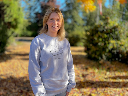 Chelsea wearing don't worry brie happy sweatshirt with fall leaves in background